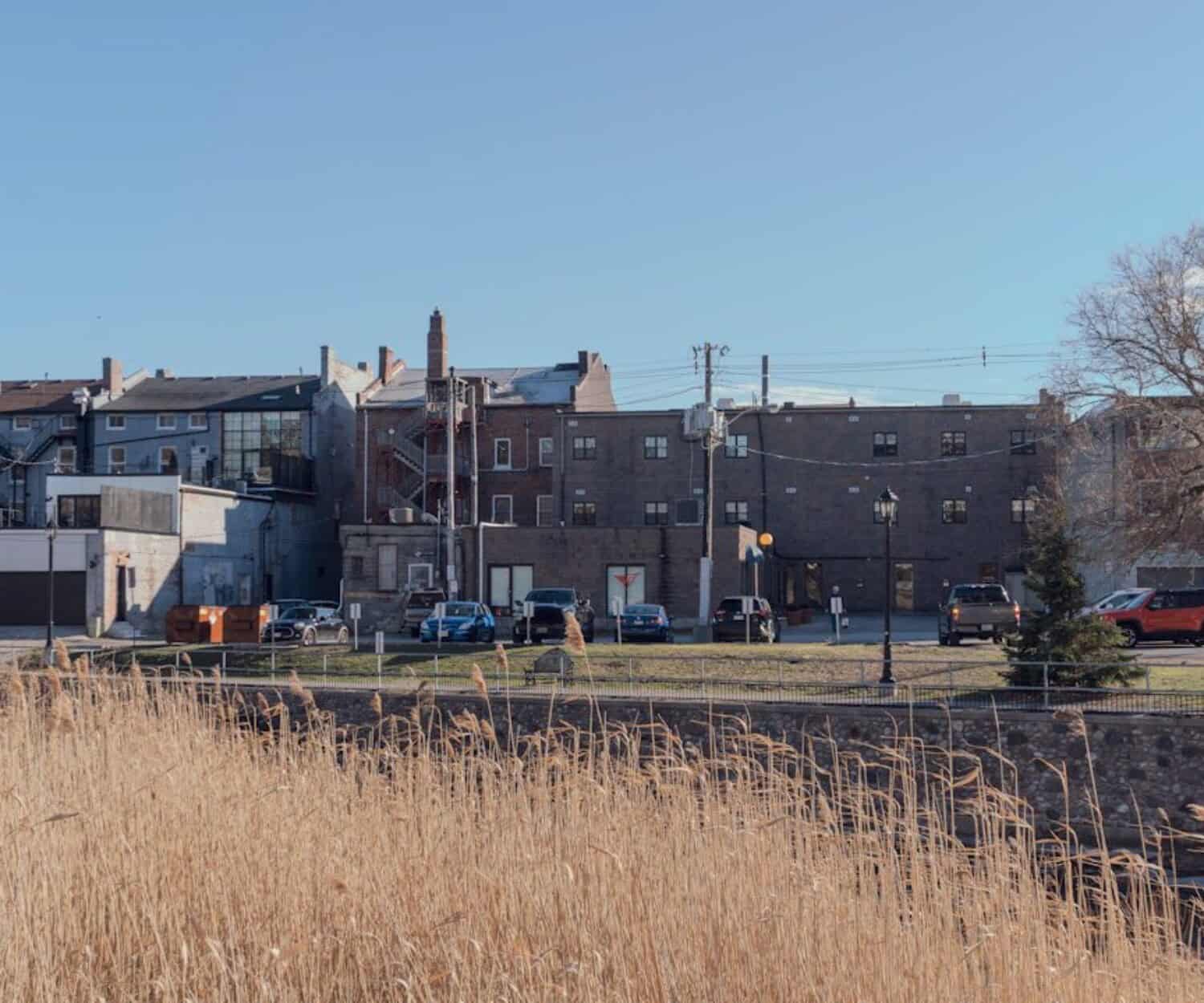 Federal Fund Housing - a large building with cars parked in front of it