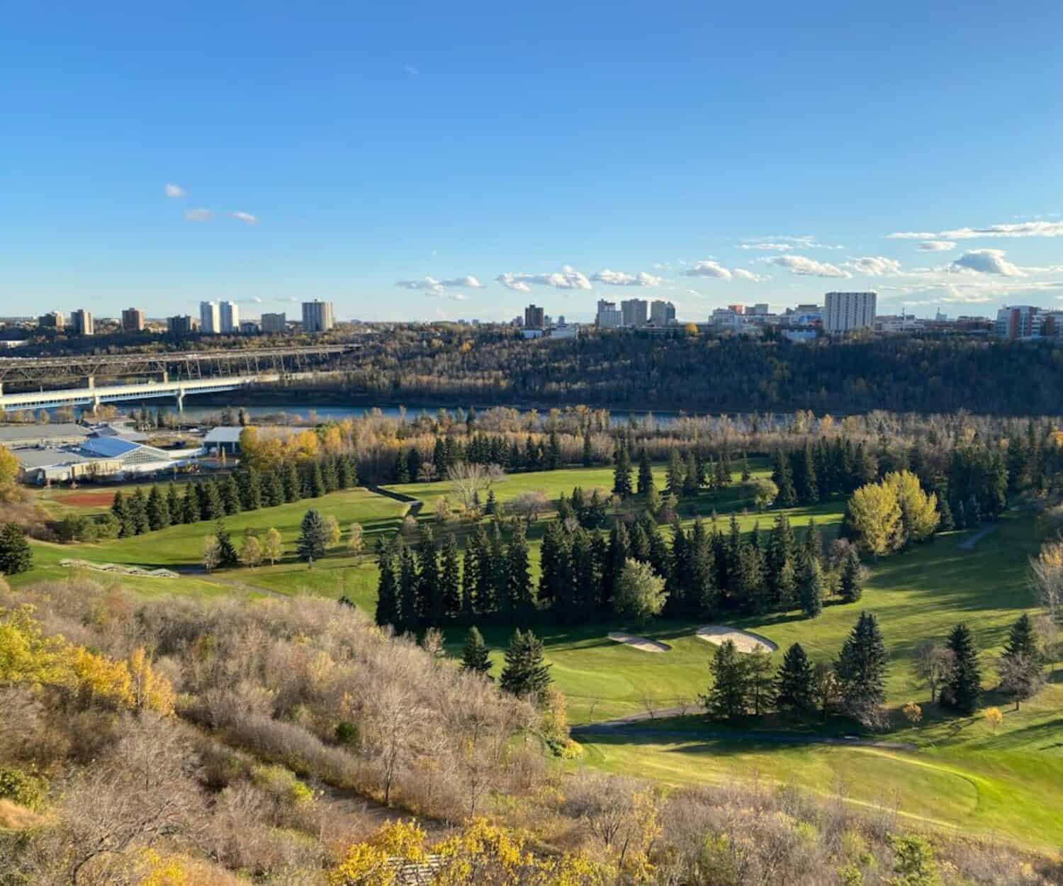GST rebate new homes - green grass field near body of water during daytime